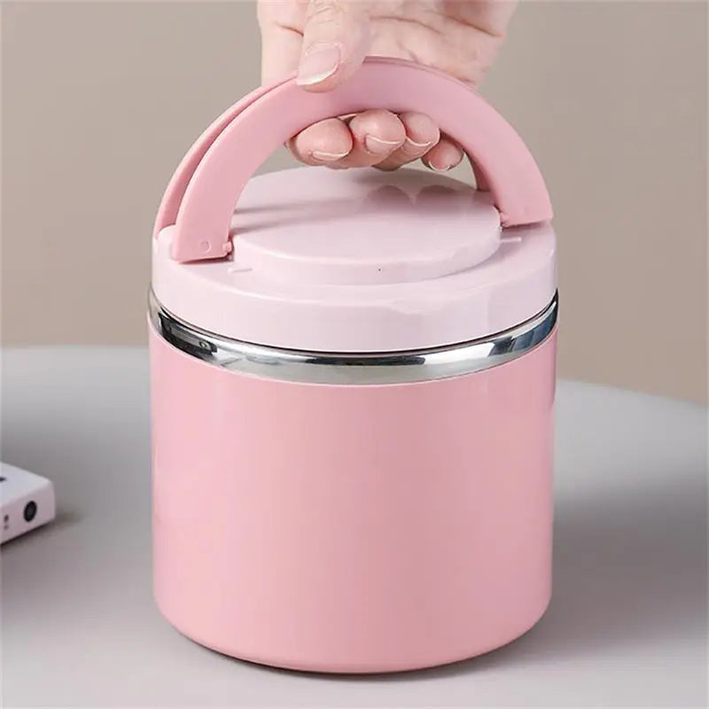 Pink lunch jar carried by its lift-up handle