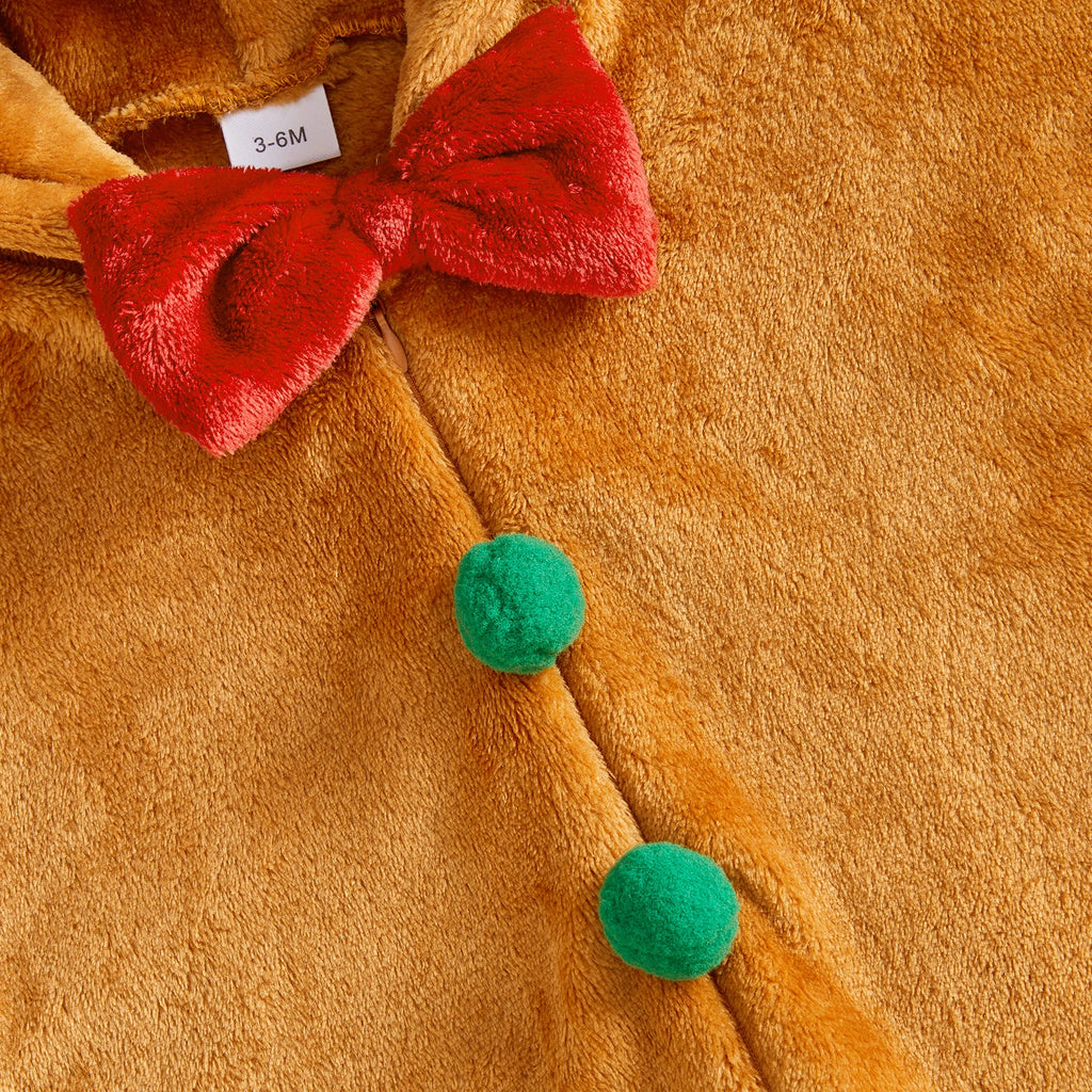 Close-up of the bow and pom-pom buttons