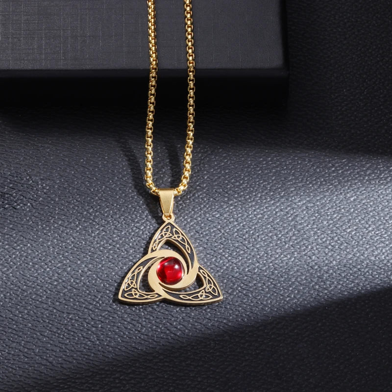 Gold Celtic Trinity Knot pendant with red crystal on box chain