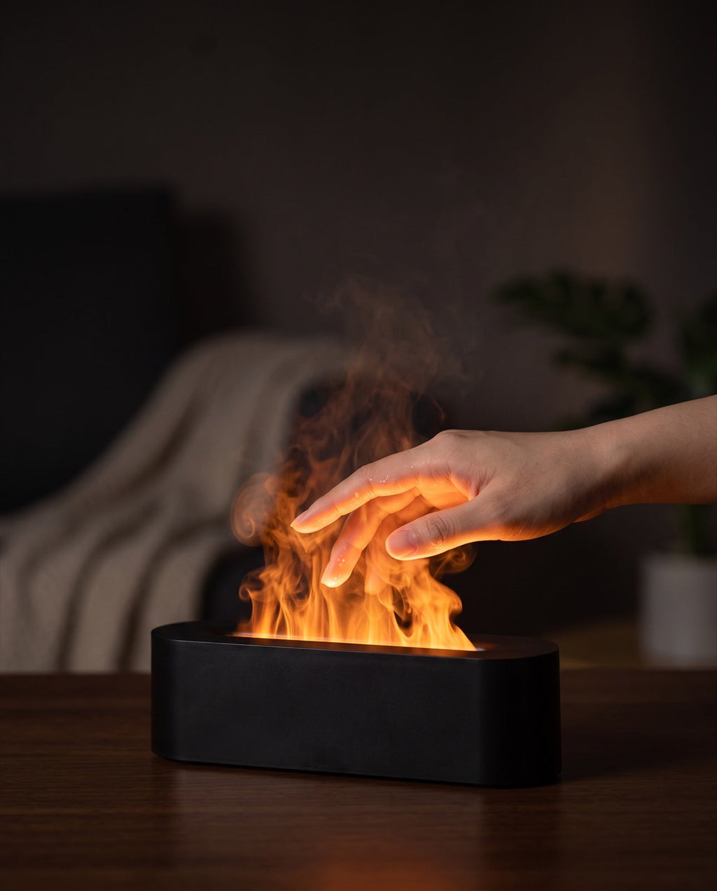 A hand passing through the mist showing there is no real flame or heat